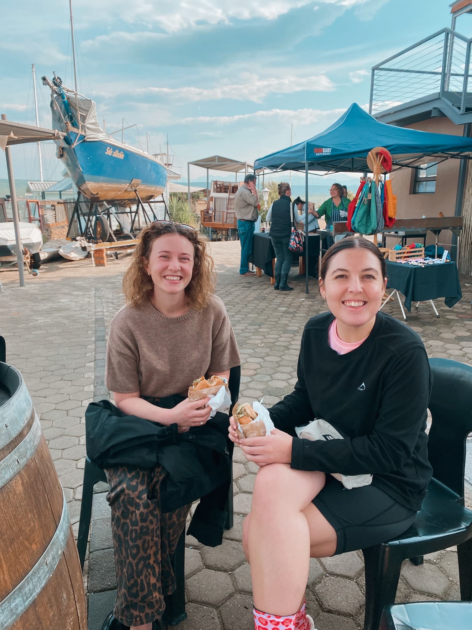 Visitors relaxing near the market stalls